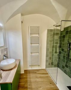 a bathroom with a sink and a shower at Via Scale Apartments, Lake Como, Brienno in Brienno