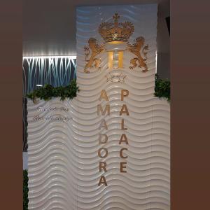 a white cake with a crown on top of it at Hotel Amadora Palace in Amadora