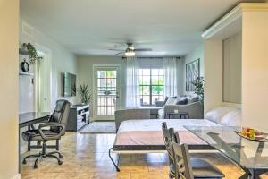 a living room with a bed and a table and chairs at Updated Scottsdale Condo Less Than 3 Mi to Old Town! in Scottsdale