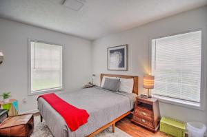 a bedroom with a bed and two windows at Updated Jackson Home about 3 Mi to JSU Stadium! in Jackson