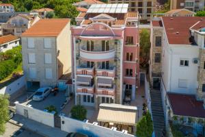 an overhead view of a building in a city at Garni Hotel Koral in Budva