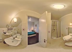 a bathroom with a sink and a toilet and a shower at Domaine De Kereven in Bénodet +61 photos