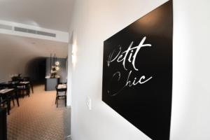 a dining room with a sign that reads left like at Victoria by Petit Chic in Mellieħa