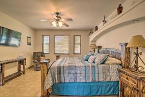 a bedroom with a bed and a ceiling fan at Rustic Las Cruces Escape - 2 Mi to NMSU! in Las Cruces
