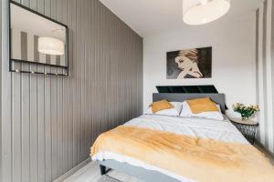 Posteľ alebo postele v izbe v ubytovaní Nocosfera Apartament Górnośląski