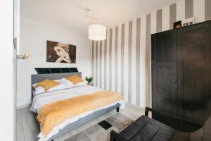 Posteľ alebo postele v izbe v ubytovaní Nocosfera Apartament Górnośląski