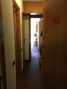 a hallway with a hallway leading to a room at Sestriere Borgata appartamento in montagna Casa di Bertu in Borgata Sestriere