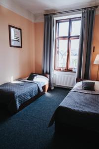 Posteľ alebo postele v izbe v ubytovaní Hotel Centrum