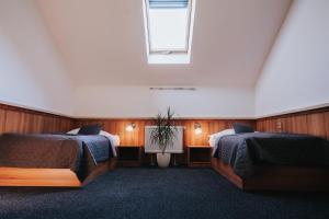 Posteľ alebo postele v izbe v ubytovaní Hotel Centrum