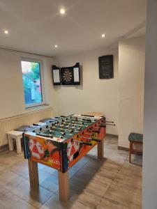 a large game table in the middle of a room at Harz meets friends in Hasselfelde