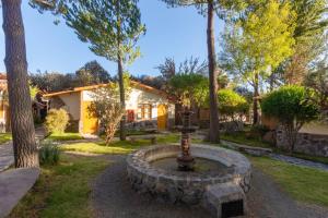 a fountain in the yard of a house at Casa Andina Standard Colca in Chivay