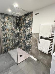 a shower with a glass door in a bathroom at Chimera House in Catania