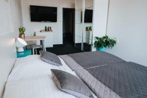 Posteľ alebo postele v izbe v ubytovaní Hotel Centrum