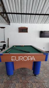 a pool table sitting in a room with at Cabañas LLano Lindo Apiay in Villavicencio