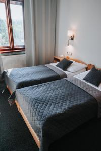 Posteľ alebo postele v izbe v ubytovaní Hotel Centrum