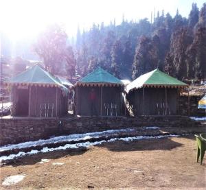a group of huts with snow on them at Camping Huts at Lord Shiva Camps in Sari