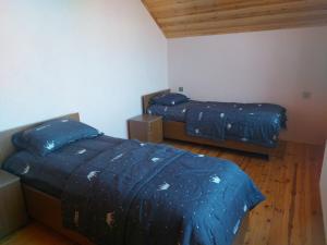 Postel nebo postele na pokoji v ubytování SUNRISE Guest House