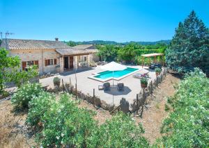 an aerial view of a villa with a swimming pool at Owl Booking Villa Gabelli - Rustic Stay with Great Views in Campanet