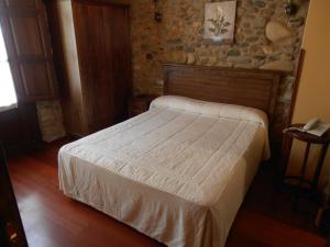 Postel nebo postele na pokoji v ubytování Hostal Virgen de la Encina