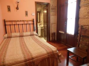 Postel nebo postele na pokoji v ubytování Hostal Virgen de la Encina