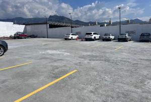 a group of cars parked in a parking lot at Capital Hotel Saltillo in Saltillo