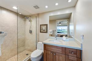 a bathroom with a shower and a toilet and a sink at Maui Banyan H311 1BD 2BA 3 min walk to the beach in the Heart of South Kihei! in Wailea