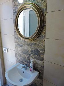 a bathroom with a sink and a mirror at Onar Luxury Villa - Adults Only in Lachania