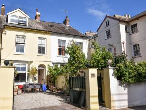 a house with a gate in front of it at 55 Queen Street in Seaton