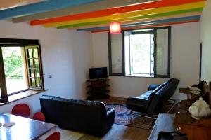 a living room with a rainbow on the ceiling at Couleurs du Daumail in Saint-Priest-sous-Aixe