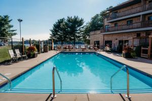 a large swimming pool in front of a building at Aloha Beach Resort in Wisconsin Dells