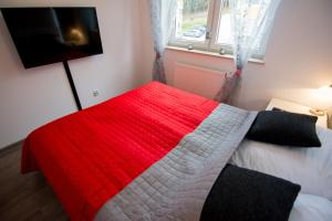 Postel nebo postele na pokoji v ubytování Apartamenty Izerskie
