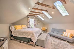 a bedroom with a bed and a couch and skylights at Sierra Sunset Inn - 3 Miles to Placerville! in Placerville