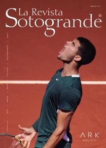 a man holding a tennis racket on a tennis court at AIRE DE SOTOGRANDE in Sotogrande