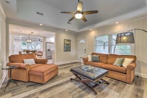 a living room with two couches and a ceiling fan at Stylish Wilmington Home, 2 Mi to Riverwalk! in Wilmington