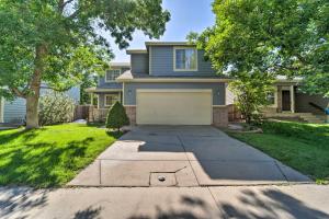 a house with a driveway and a garage at Family Home with Fenced Yard 15 Mi to Denver! in Broomfield