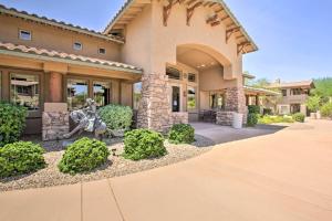 a house with a statue in front of it at Scottsdale Condo with Balcony and Resort Amenities! in Scottsdale