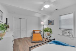 a living room with a bed and a window at Spacious 3-Bedroom Bungalow in Bradley Beach in Bradley Beach