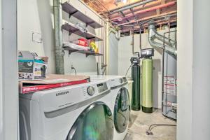 a washing machine in a laundry room with pipes at Pet-Friendly Home, 5 Mi to State Park with Lake in Four Towns