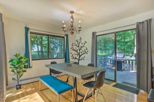 a dining room with a table and chairs at Poconos Gem Fire Pit, Hot Tub, Community Pool in East Stroudsburg