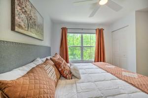 a bedroom with two beds and a window at Kissimmee Condo Community Perks, 10 Mi to Disney! in Kissimmee +24 photos