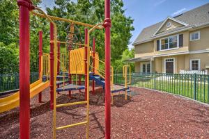 a playground with a yellow and blue slide at Kissimmee Condo Community Perks, 10 Mi to Disney! in Kissimmee