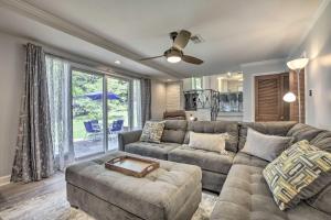 a living room with a couch and a table at Updated High Point Retreat with Pool and Backyard in High Point