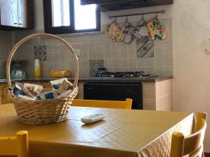 a kitchen with a table with a basket on it at IL PROFUMO DEL MARE in Palermo