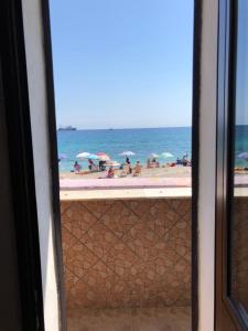 a view of the beach from a window at IL PROFUMO DEL MARE in Palermo