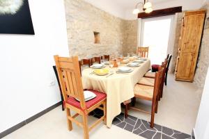 a dining room with a table and chairs at Luxury villa with a swimming pool Manjadvorci, Marcana - 7731 in Barban