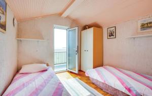 Posteľ alebo postele v izbe v ubytovaní Apartments with a parking space Lovran, Opatija - 7673