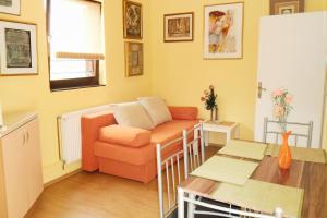 a living room with a couch and a table at Apartments with WiFi Opric, Opatija - 7756 in Lovran