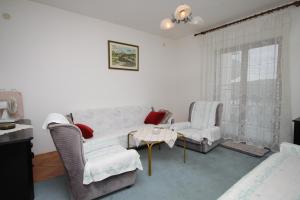 a living room with a couch and chairs and a table at Apartments with a parking space Pula - 7681 in Pula