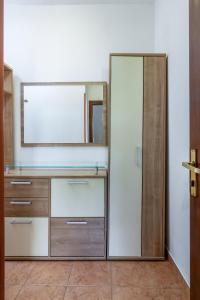 a dressing room with a mirror and a dresser at Apartments with parking space Medulin - 7657 in Medulin