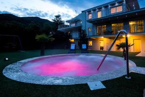 a large pool of water in front of a house at Luxury villa with a swimming pool Opatija - Pobri, Opatija - 7843 in Matulji